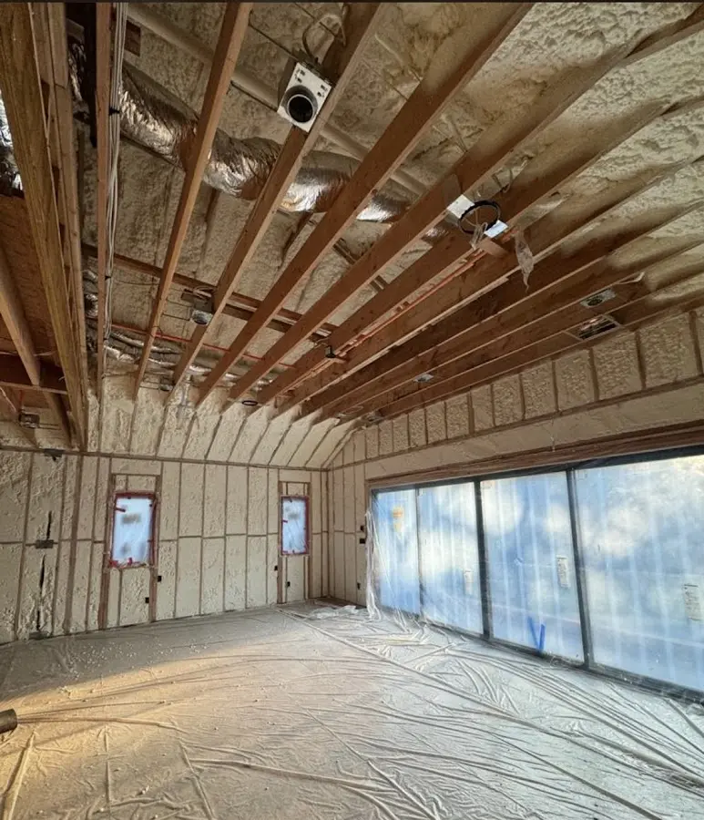 Interior walls and ceiling insulated with spray foam during new construction in East Bakersfield